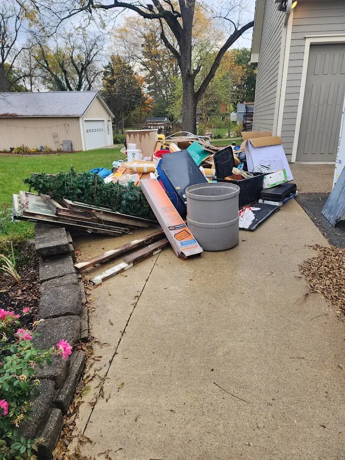 Dumpster being loaded with debris for 3 Yard Dumpster Rental in Whitney